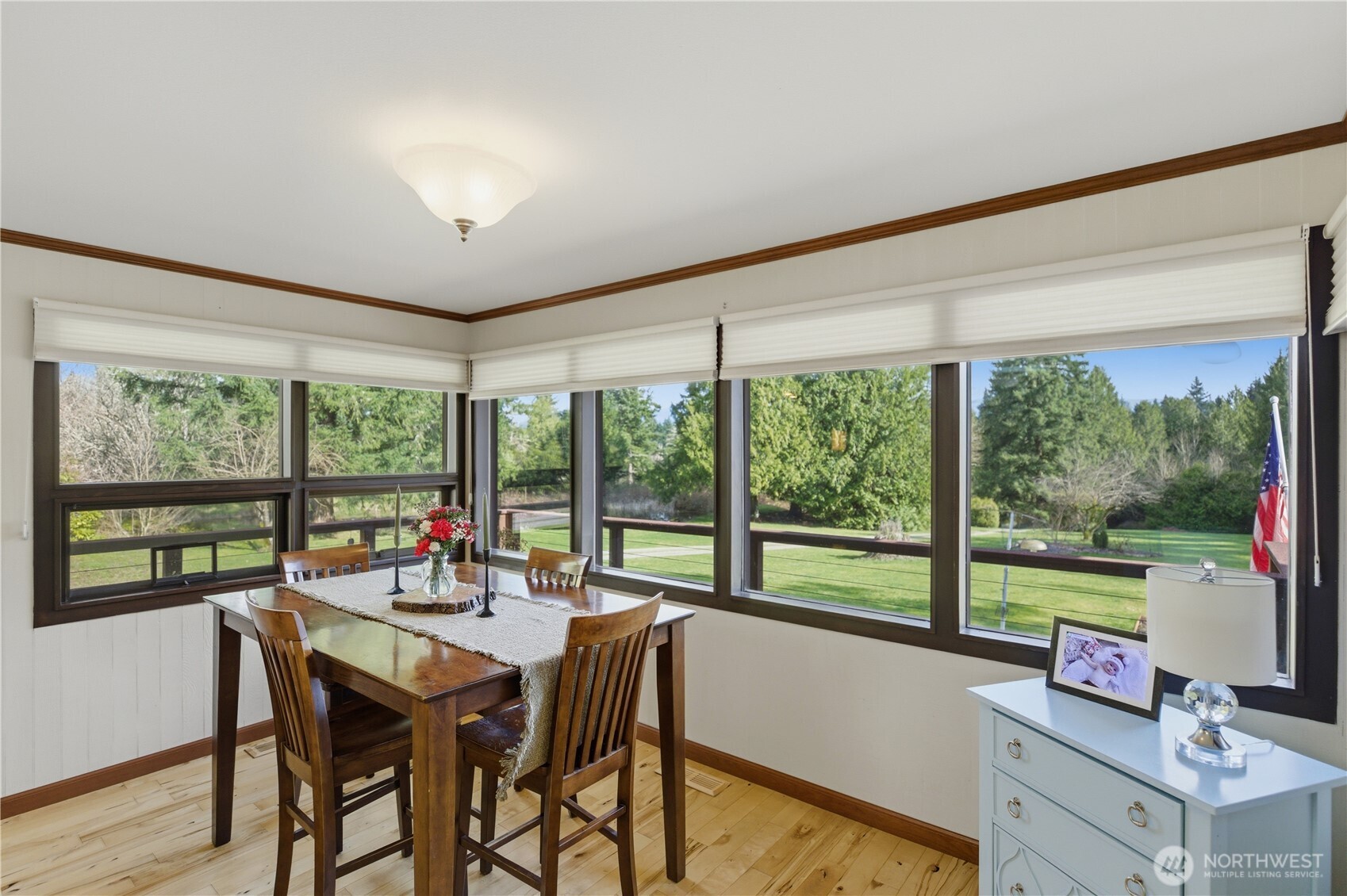 14608 A P Tubbs Road East Buckley, WA 98321 - Photo 13 of 39 a view of a dining room with furniture large windows and wooden floor