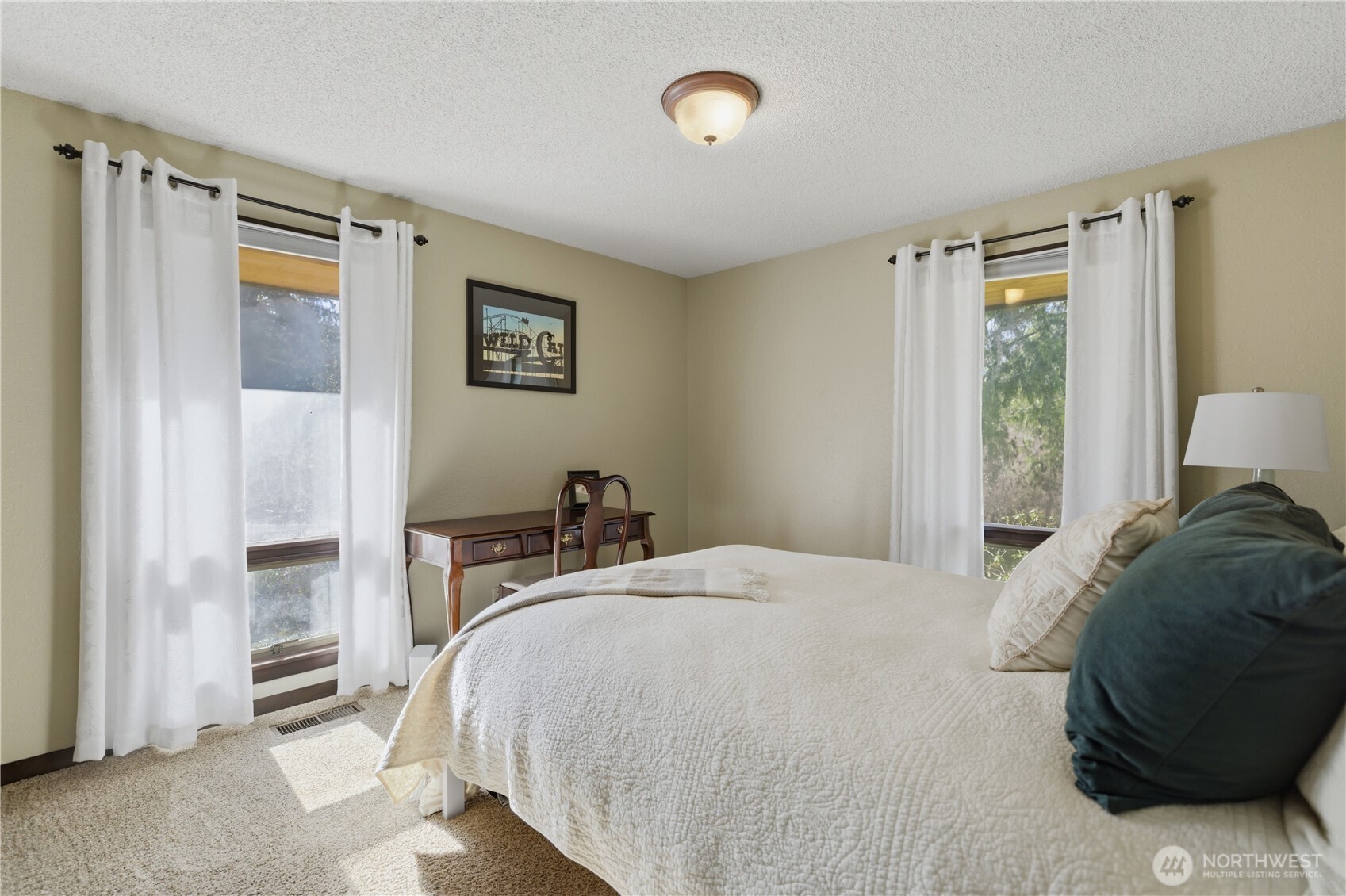 14608 A P Tubbs Road East Buckley, WA 98321 - Photo 16 of 39 a bedroom with a bed and a window