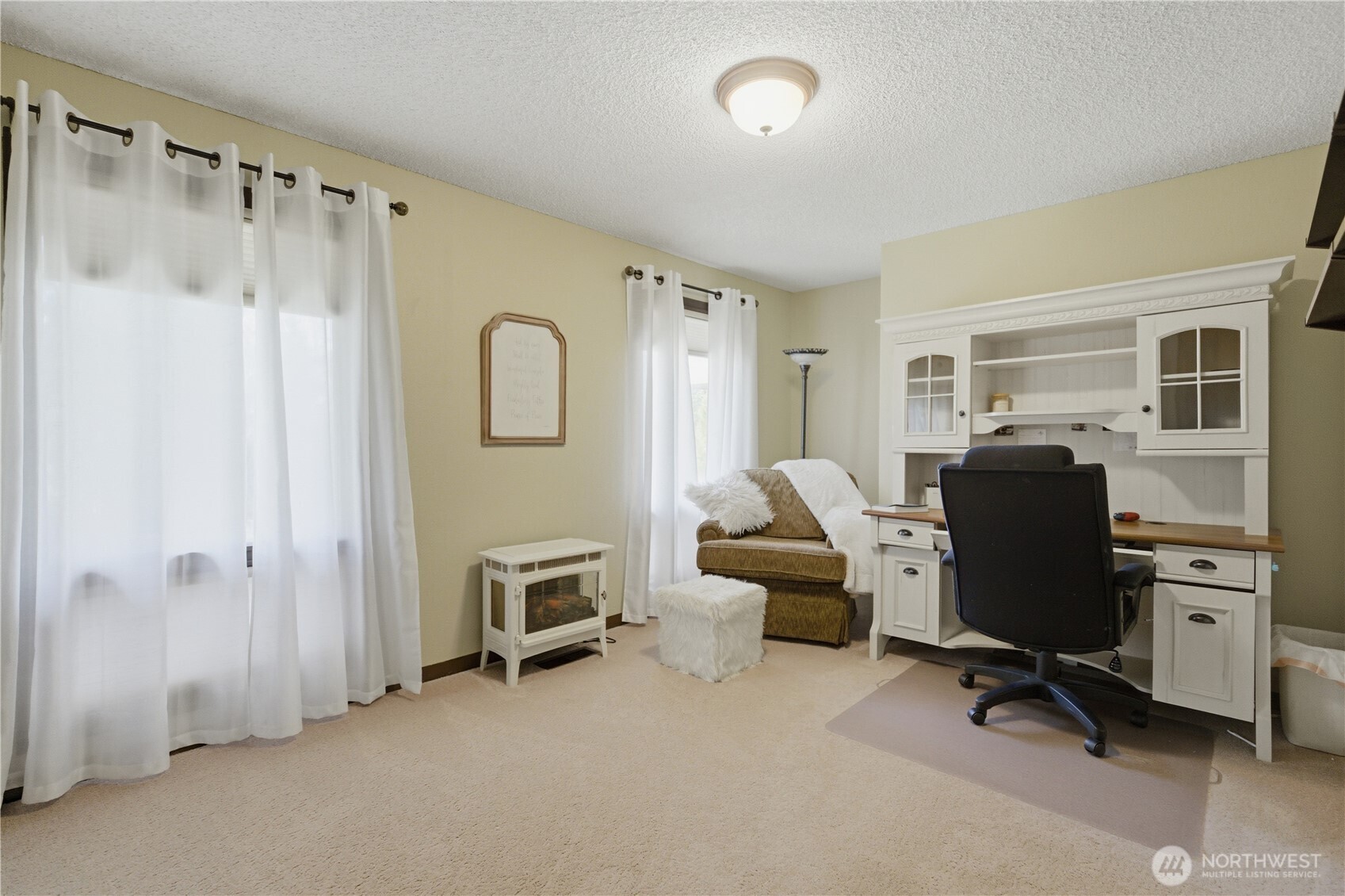 14608 A P Tubbs Road East Buckley, WA 98321 - Photo 17 of 39 a view of a workspace with furniture and a window