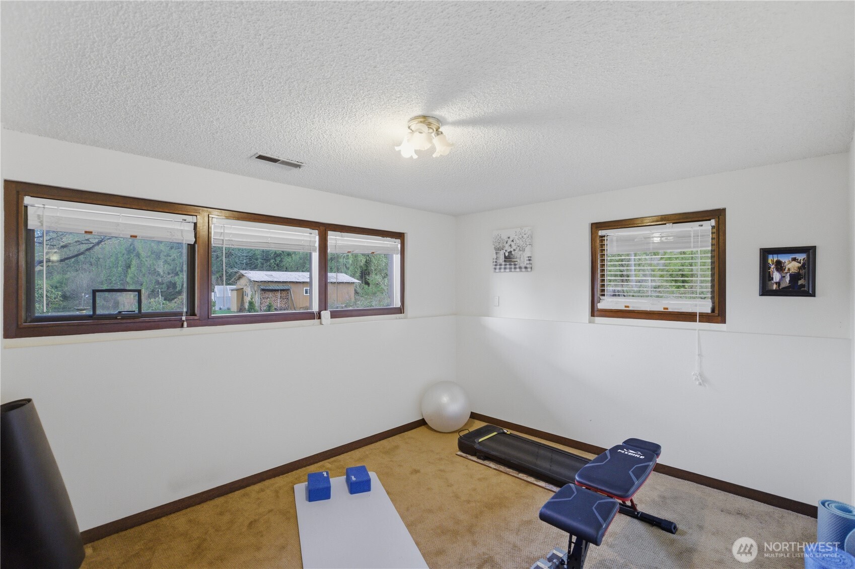 14608 A P Tubbs Road East Buckley, WA 98321 - Photo 20 of 39 a room with furniture and a window
