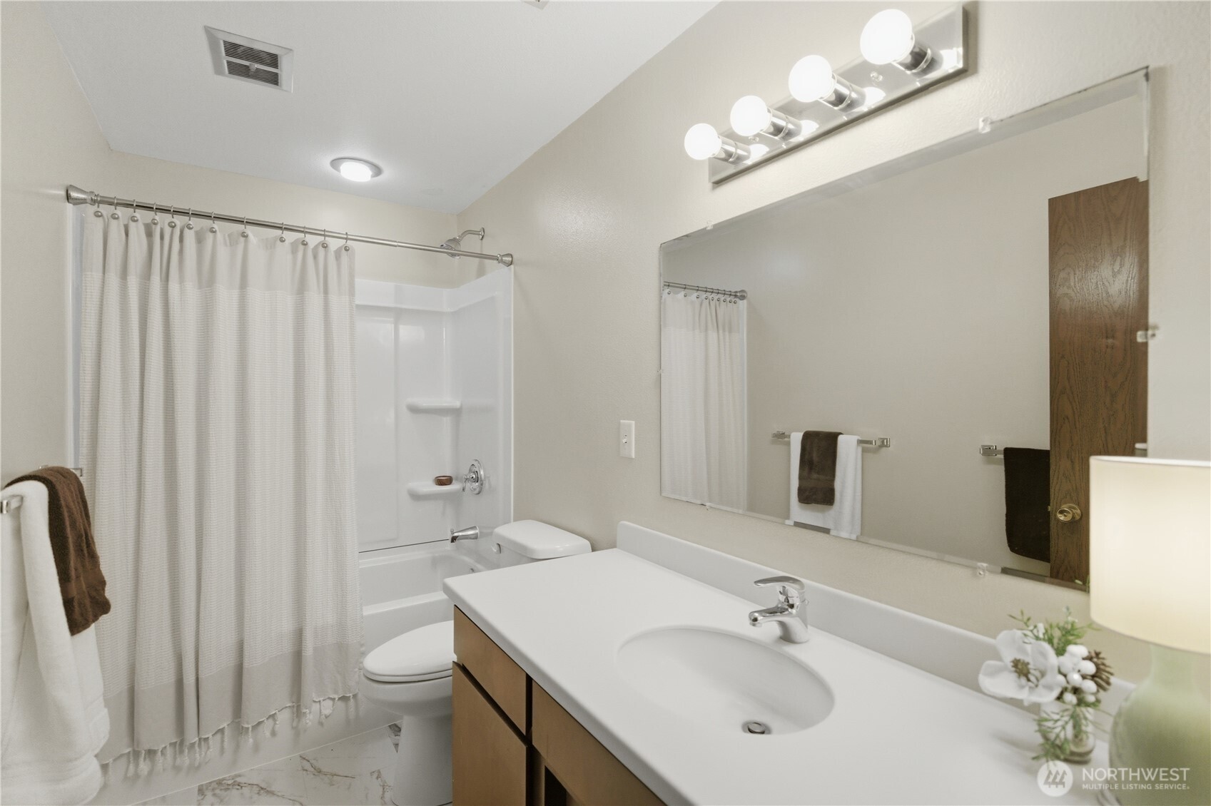 14608 A P Tubbs Road East Buckley, WA 98321 - Photo 21 of 39 a bathroom with a sink a toilet and shower