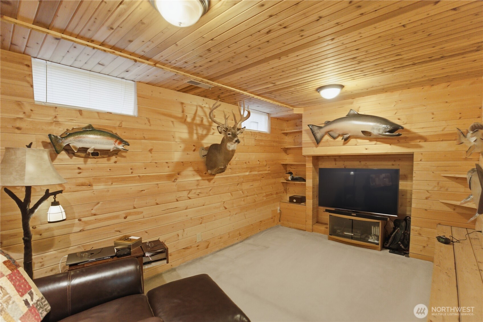 14608 A P Tubbs Road East Buckley, WA 98321 - Photo 22 of 39 a living room with a flat screen tv and a fireplace