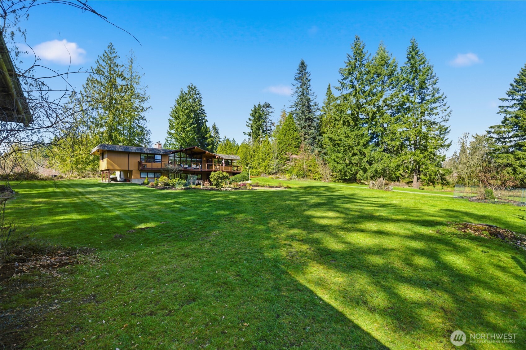 14608 A P Tubbs Road East Buckley, WA 98321 - Photo 34 of 39 a backyard of a house with table and chairs