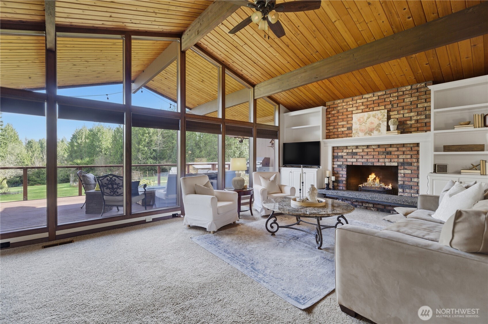 14608 A P Tubbs Road East Buckley, WA 98321 - Photo 6 of 39 a living room with furniture tv and a fireplace