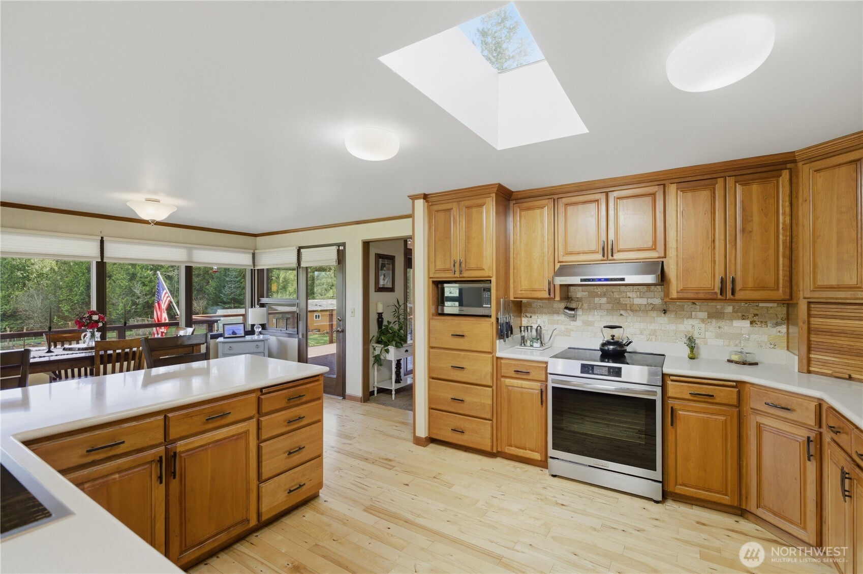 14608 A P Tubbs Road East Buckley, WA 98321 - Photo 7 of 39 a kitchen with stainless steel appliances kitchen island granite countertop a sink stove and refrigerator