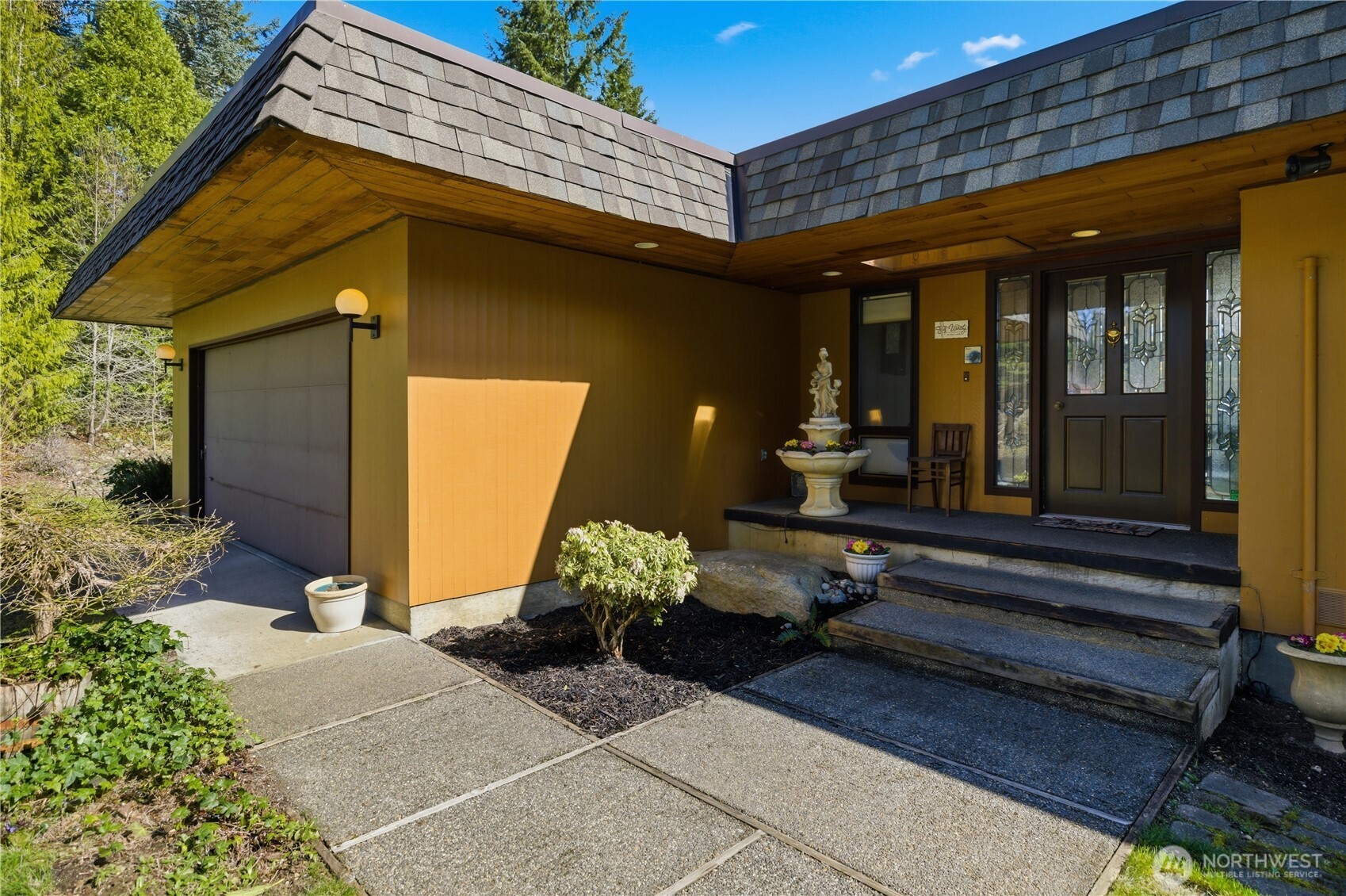 14608 A P Tubbs Road East Buckley, WA 98321 - Photo 8 of 39 a building outdoor space with patio furniture and potted plants