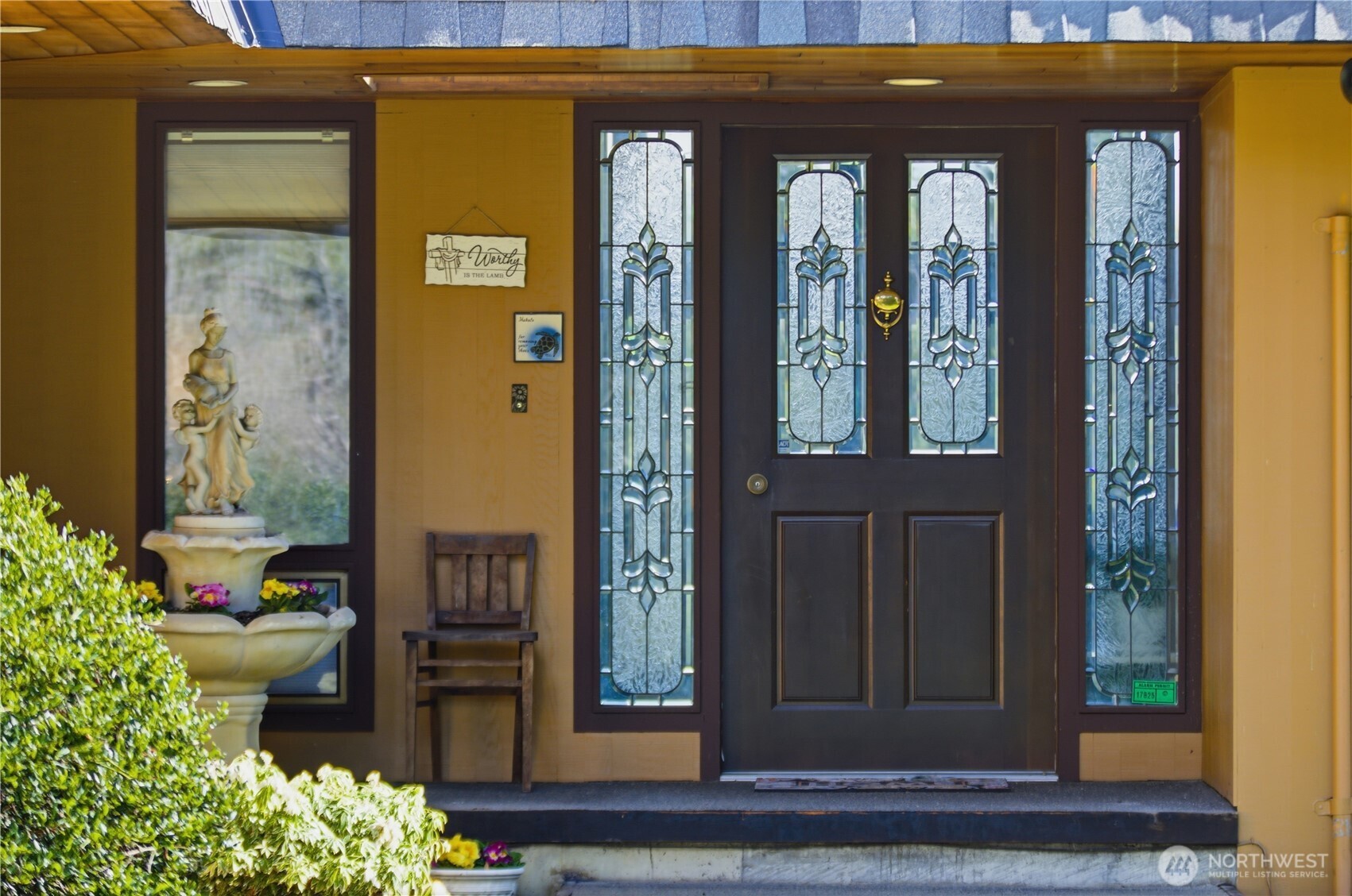 14608 A P Tubbs Road East Buckley, WA 98321 - Photo 9 of 39 a front view of a house with a potted plant windows