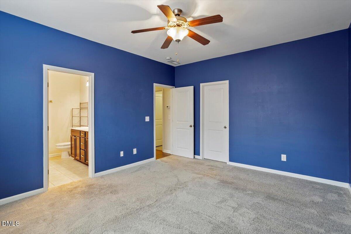 2105 Pear Tree Lane Durham, NC 27703 - Photo 18 of 35 a view of a livingroom with a ceiling fan and window