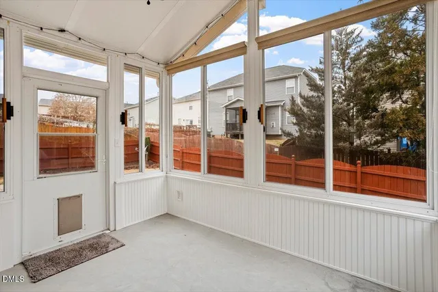a view of an empty room with a large window
