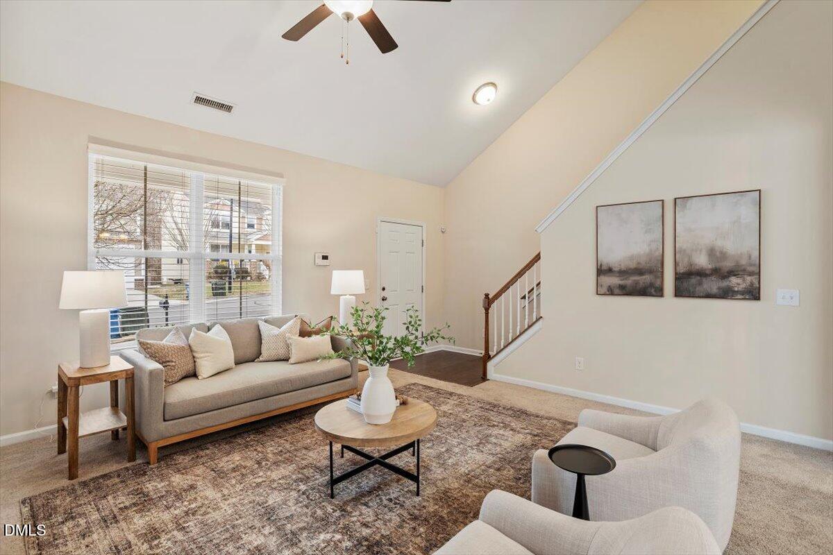 2105 Pear Tree Lane Durham, NC 27703 - Photo 6 of 35 a living room with furniture and a potted plant