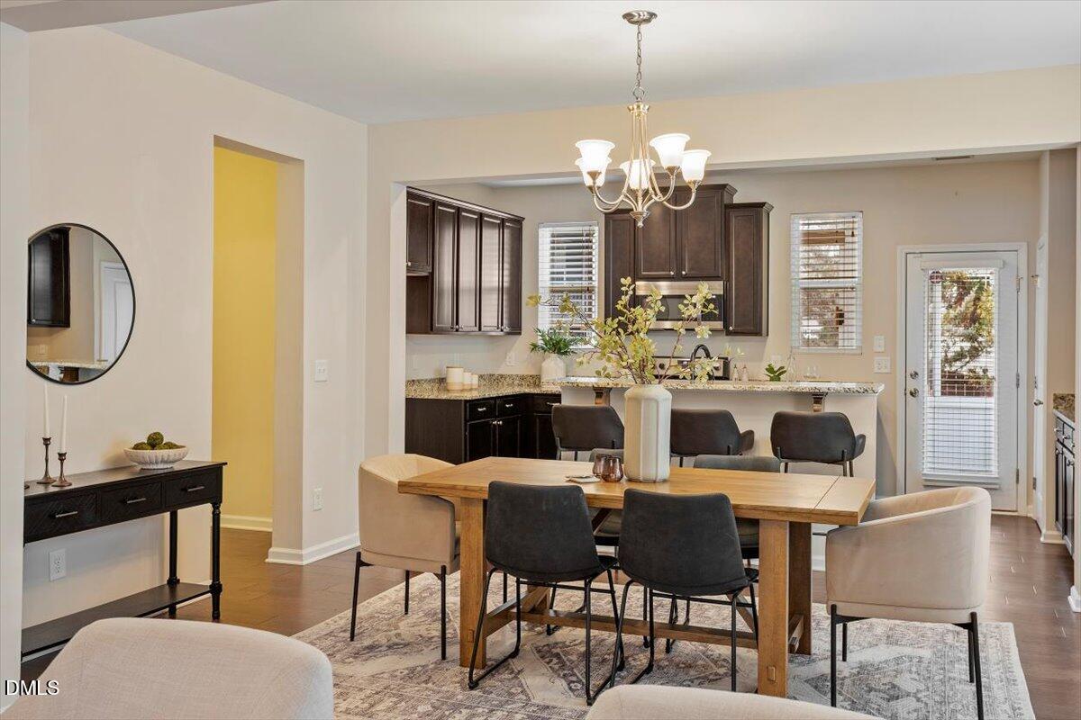 2105 Pear Tree Lane Durham, NC 27703 - Photo 8 of 35 a view of a dining room with furniture and chandelier