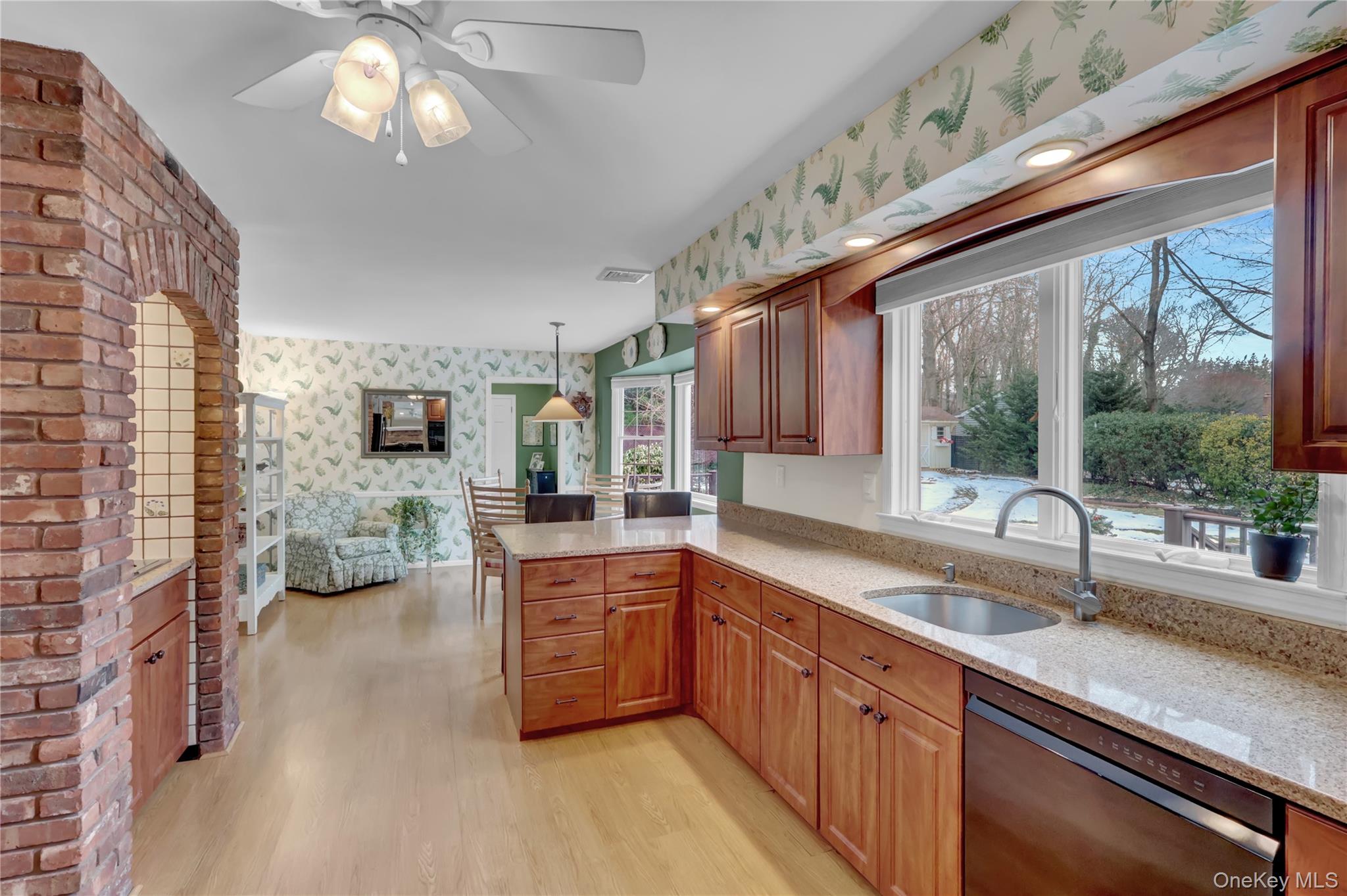 6 Samuels Path Miller Place, NY 11764 - Photo 11 of 47 a kitchen with stainless steel appliances granite countertop a sink and a large window