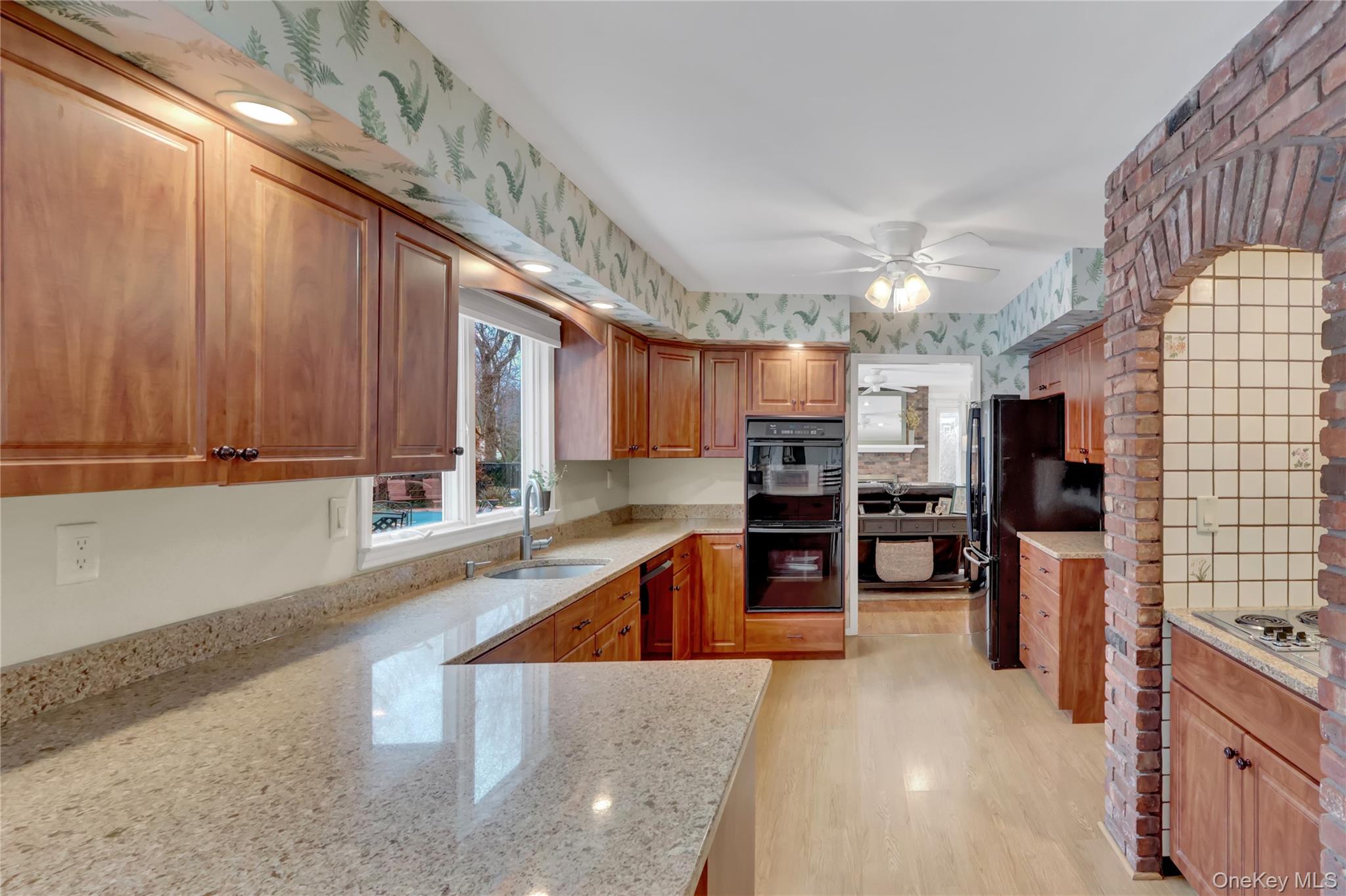 6 Samuels Path Miller Place, NY 11764 - Photo 12 of 47 a kitchen with lots of counter top space and stainless steel appliances