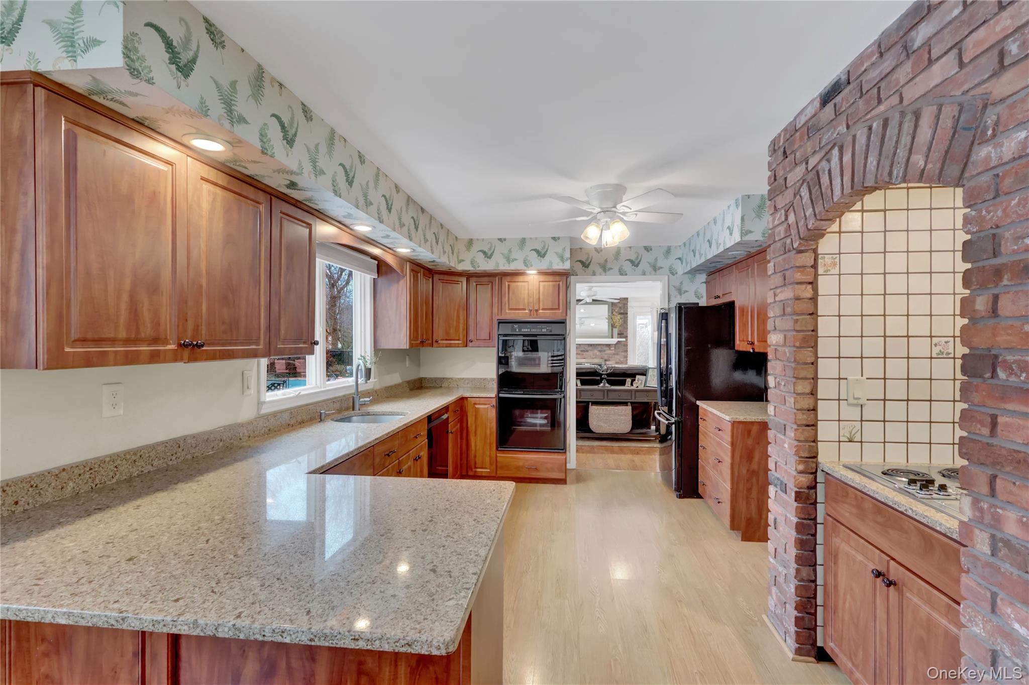 6 Samuels Path Miller Place, NY 11764 - Photo 13 of 47 a kitchen with stainless steel appliances granite countertop a sink a stove counter space and cabinets