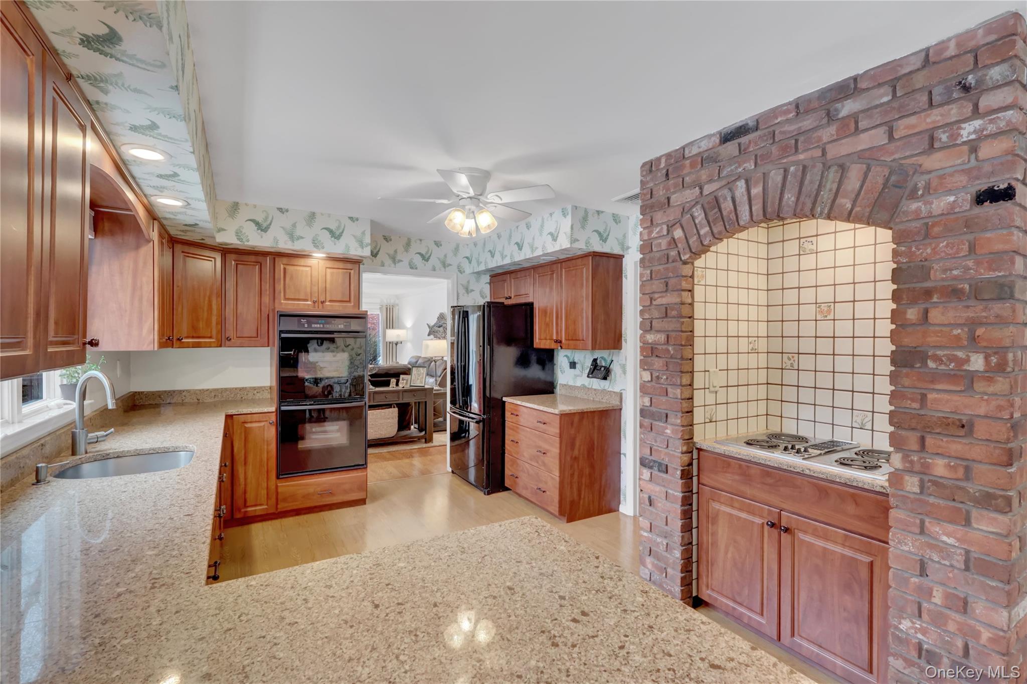 6 Samuels Path Miller Place, NY 11764 - Photo 14 of 47 a kitchen with stainless steel appliances kitchen island granite countertop a stove refrigerator and cabinets