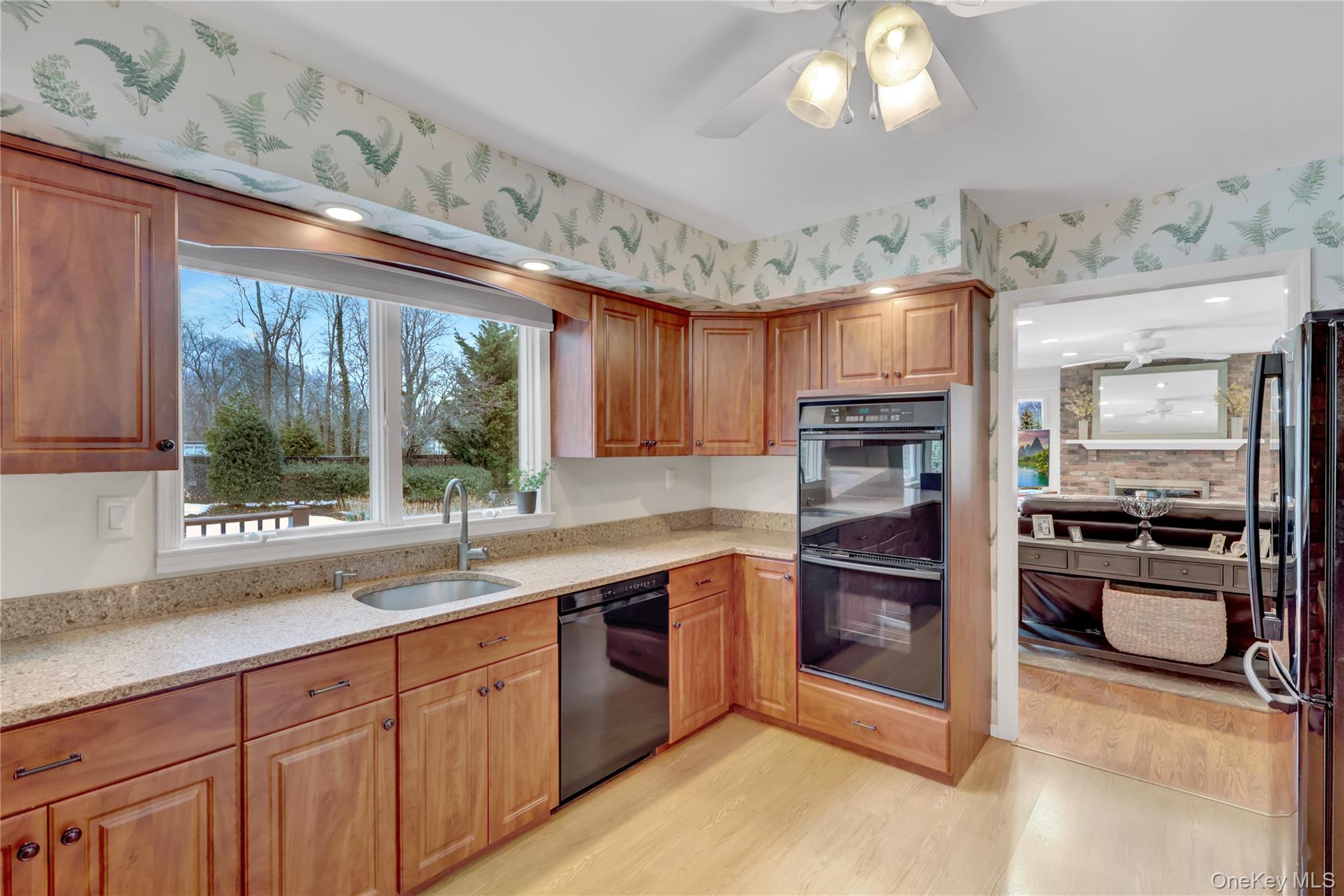 6 Samuels Path Miller Place, NY 11764 - Photo 19 of 47 a kitchen with stainless steel appliances granite countertop a stove refrigerator and sink