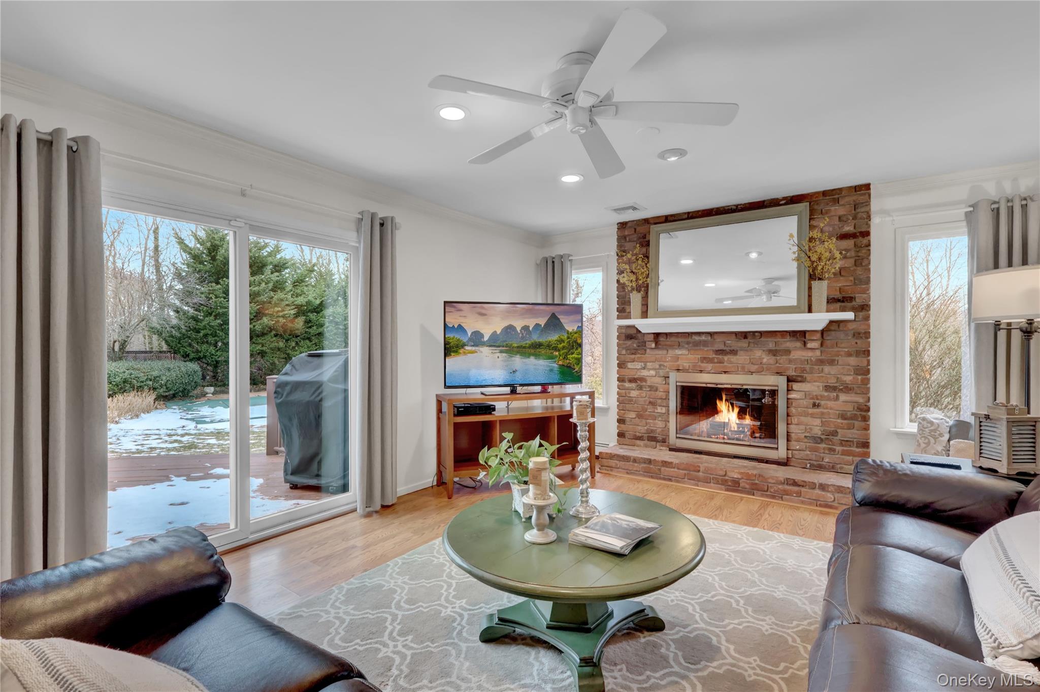 6 Samuels Path Miller Place, NY 11764 - Photo 20 of 47 a living room with furniture and a fireplace