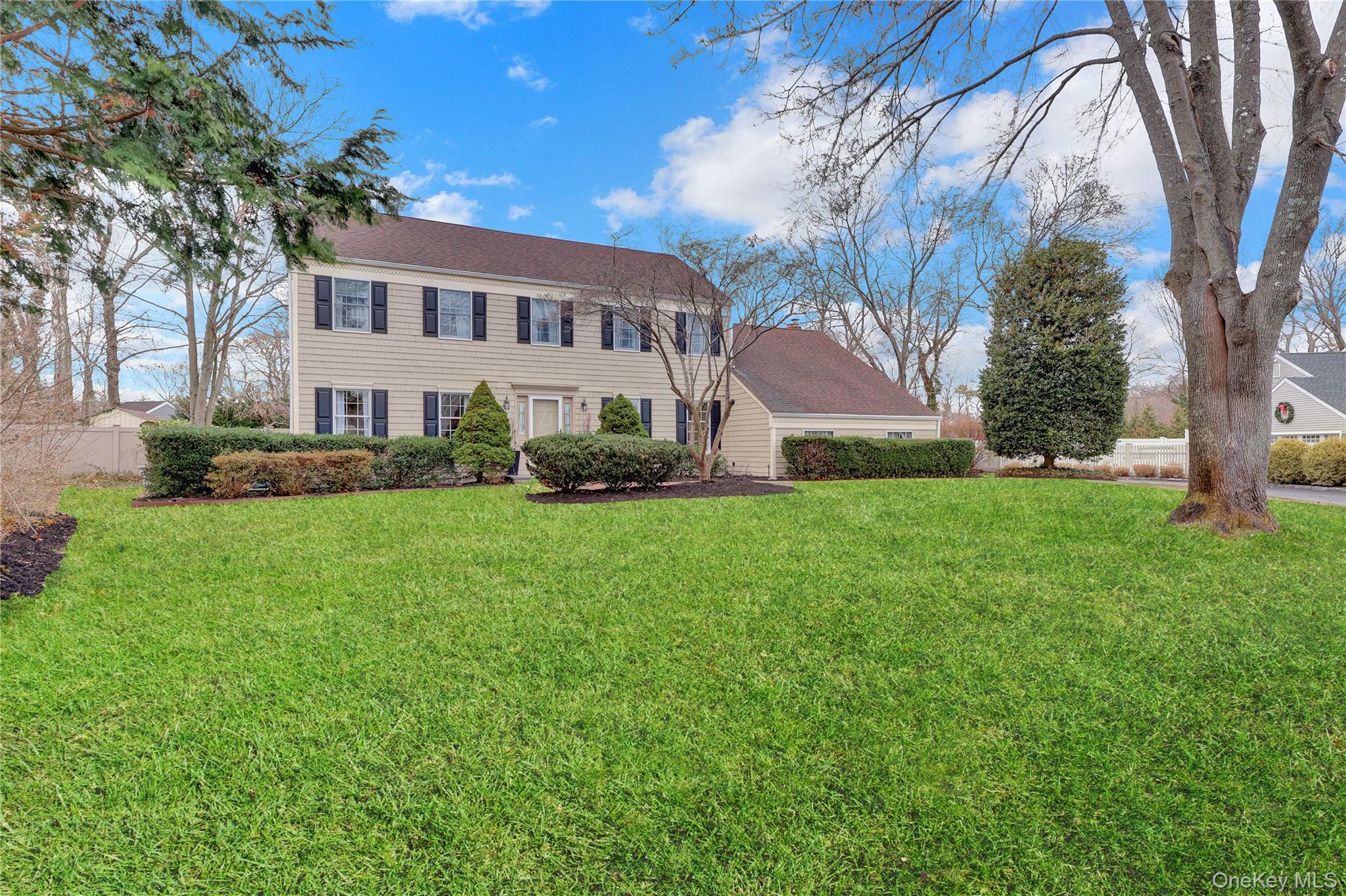 6 Samuels Path Miller Place, NY 11764 - Photo 2 of 47 a view of house with a big yard and large trees