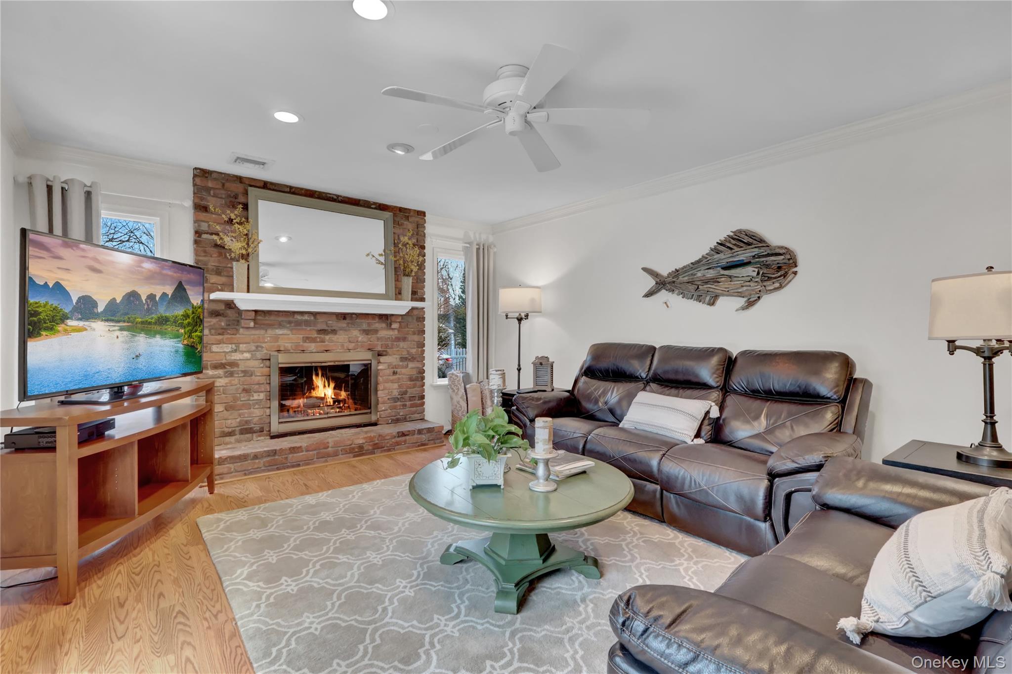 6 Samuels Path Miller Place, NY 11764 - Photo 21 of 47 a living room with furniture and a fireplace