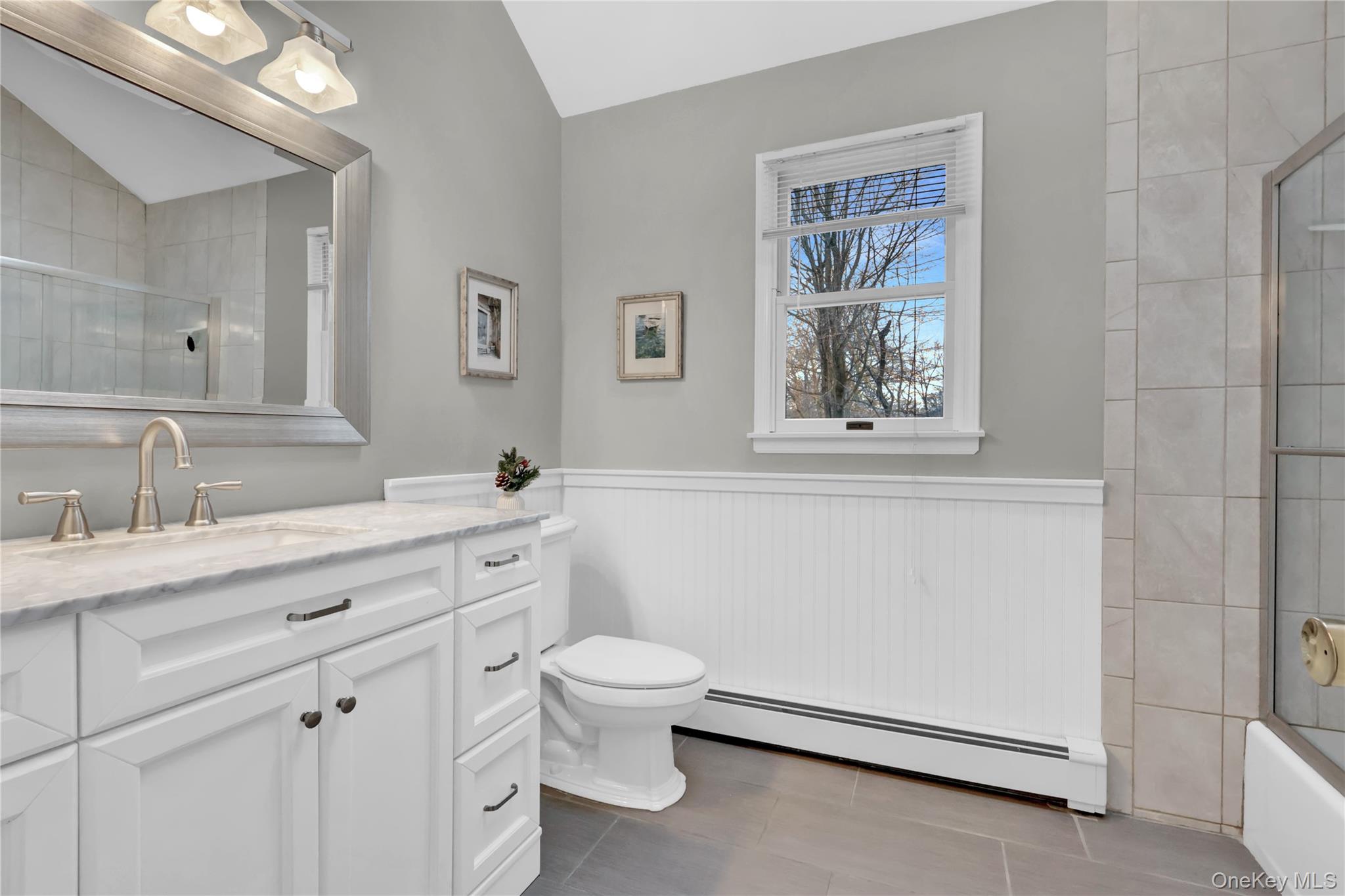 6 Samuels Path Miller Place, NY 11764 - Photo 33 of 47 a spacious bathroom with a granite countertop sink a toilet and a window