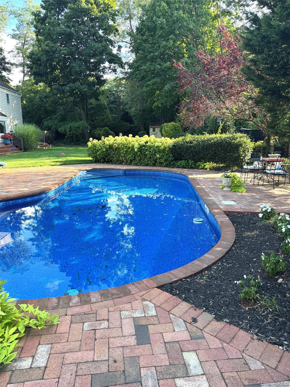 6 Samuels Path Miller Place, NY 11764 - Photo 38 of 47 a view of a swimming pool with an outdoor space