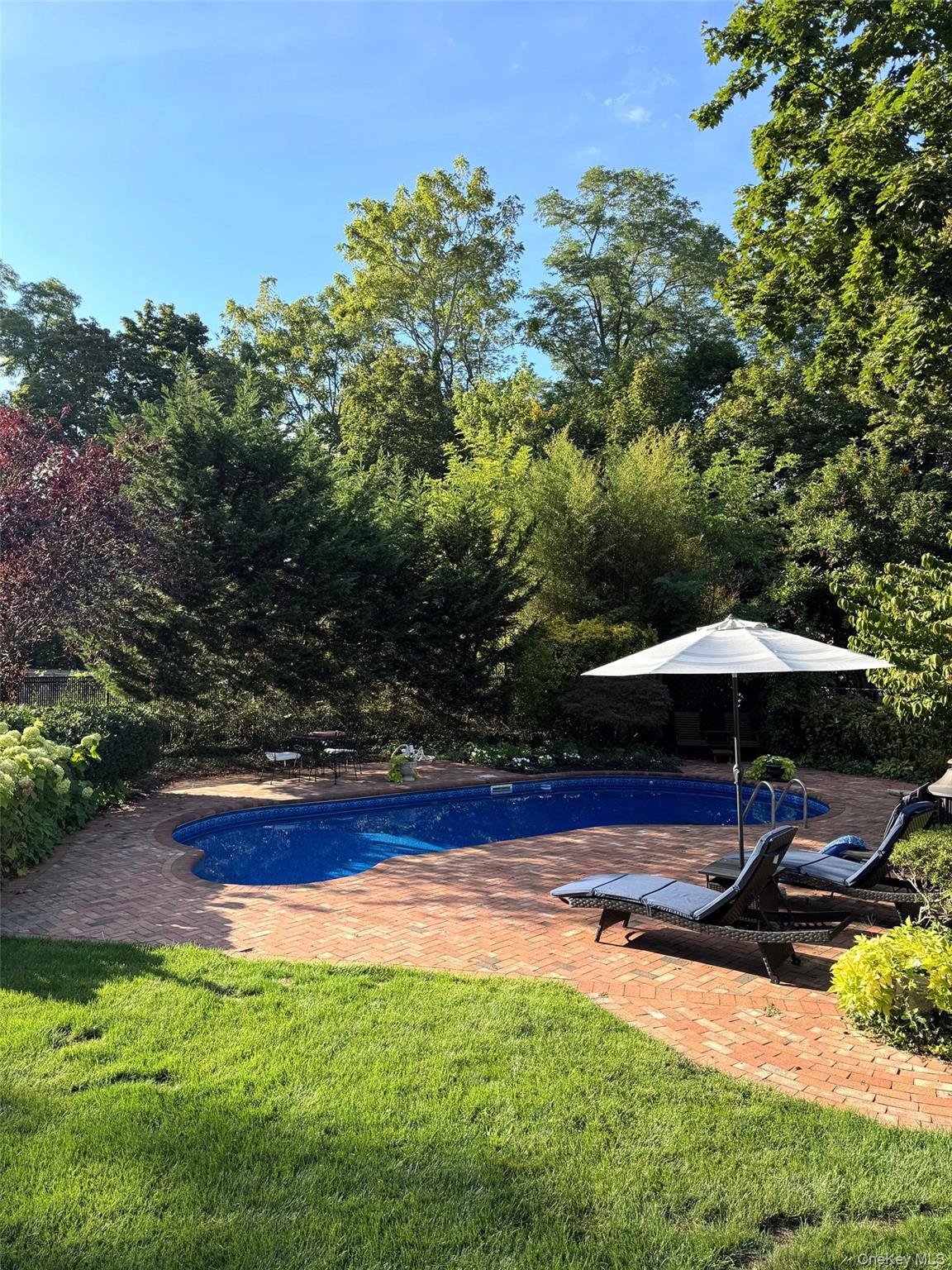 6 Samuels Path Miller Place, NY 11764 - Photo 39 of 47 a view of a sitting area with an umbrella