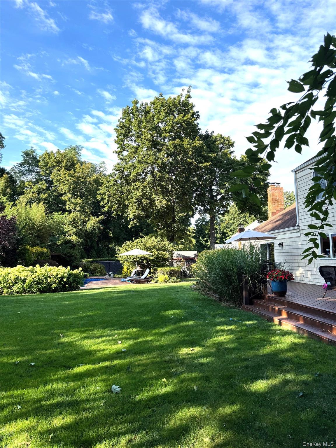 6 Samuels Path Miller Place, NY 11764 - Photo 41 of 47 a view of a house with a yard porch and sitting area