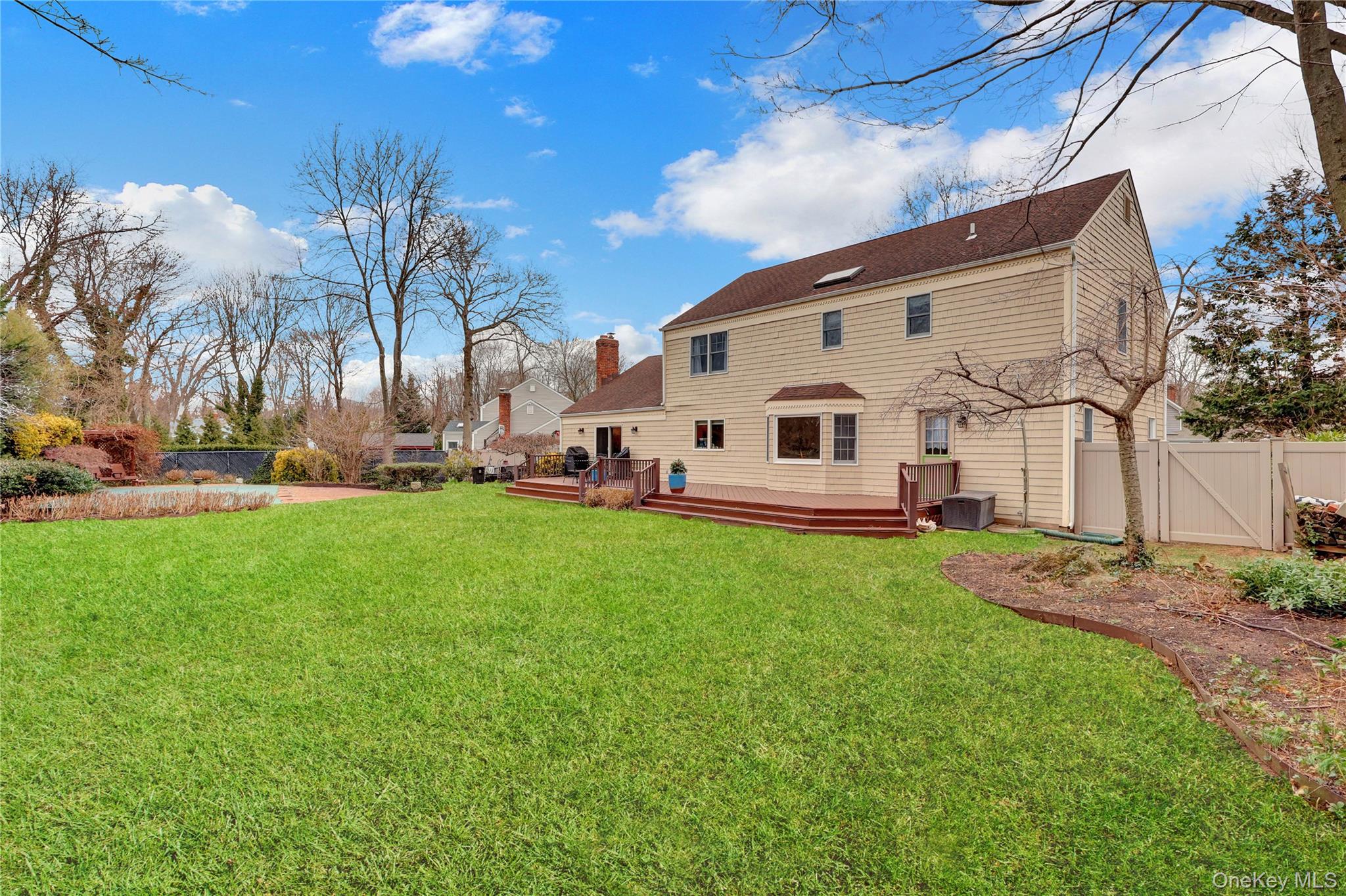 6 Samuels Path Miller Place, NY 11764 - Photo 46 of 47 a view of a white house with a big yard and large trees