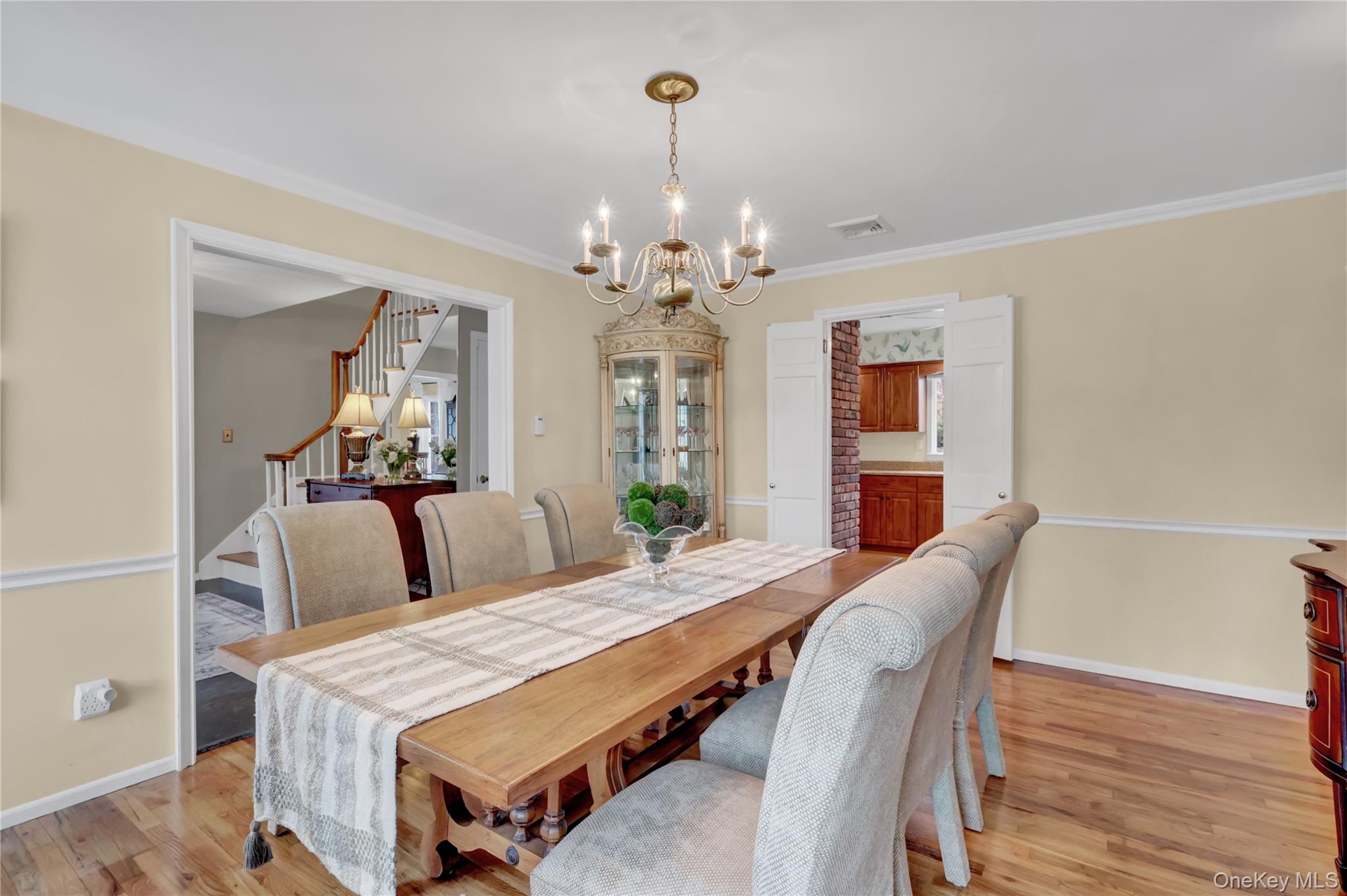 6 Samuels Path Miller Place, NY 11764 - Photo 10 of 47 a bedroom with a bed and wooden floor