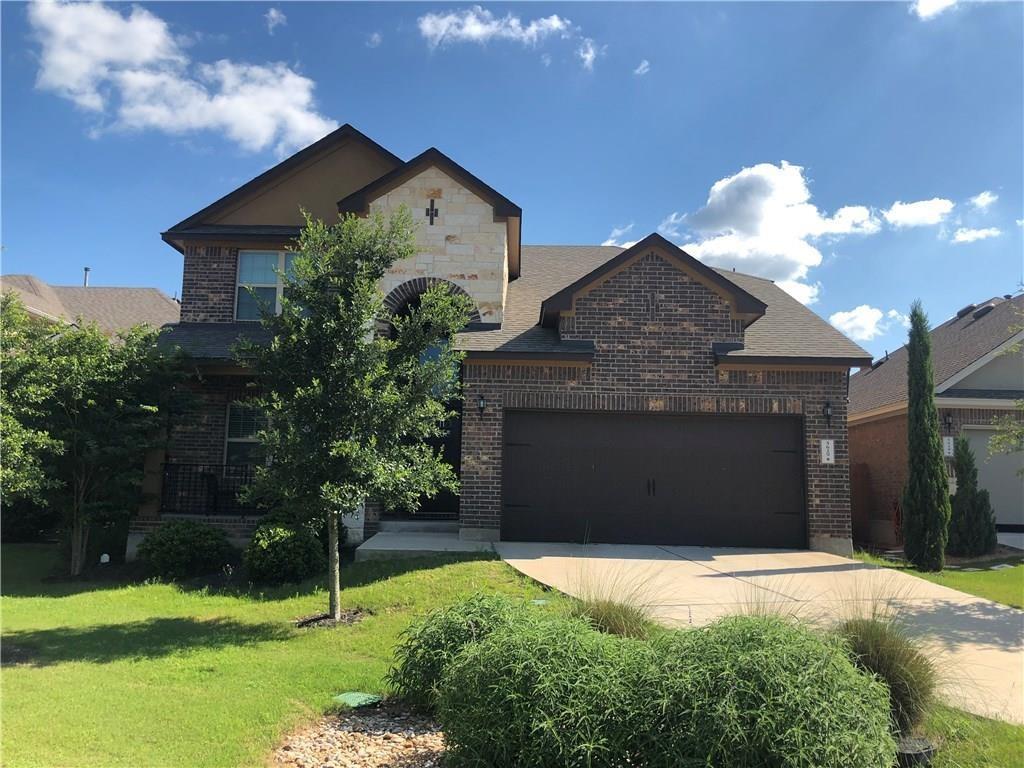 5629 Rio Chama Cove Austin, TX 78738 - Photo 1 of 34 A striking brick and stone façade welcomes you to this inviting residence.