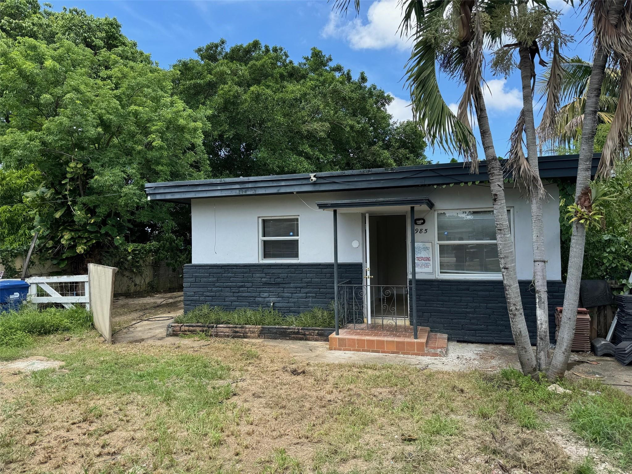 7979 Northwest 1st Place, Unit 2 Miami, FL 33150 - Photo 2 of 15 front view of a house with a yard