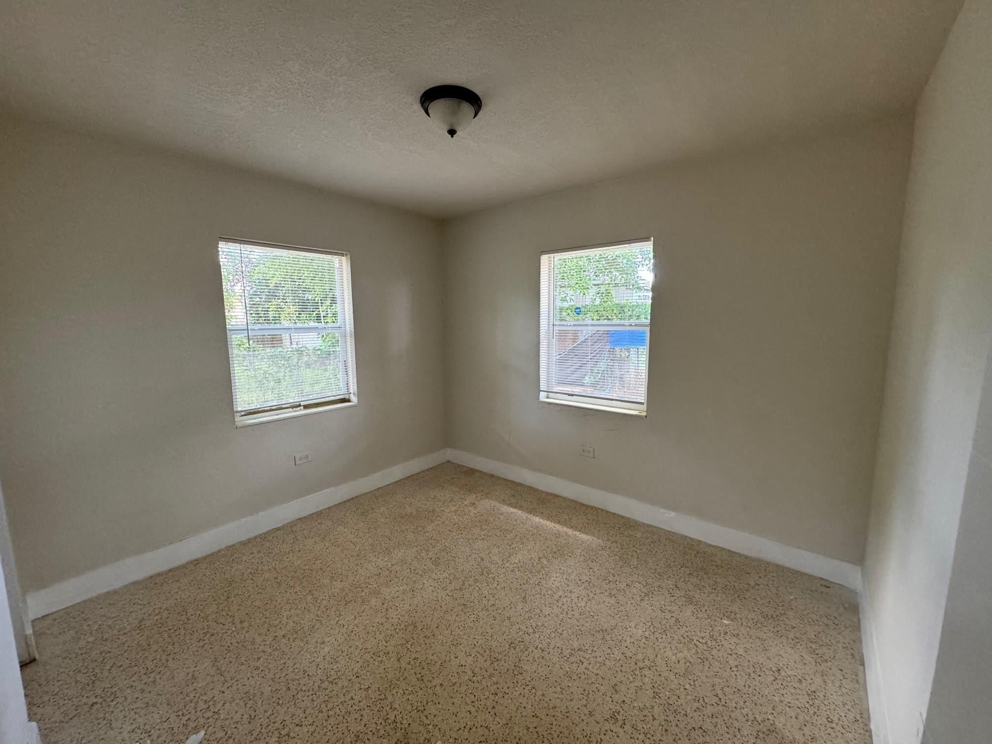 7979 Northwest 1st Place, Unit 2 Miami, FL 33150 - Photo 9 of 15 an empty room with windows