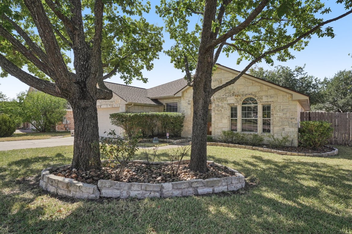 1105 Pigeon Forge Road Pflugerville, TX 78660 - Photo 2 of 19 a front view of a house with a yard