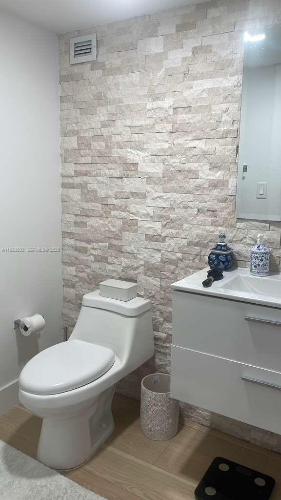 1865 Brickell Avenue, Unit A604 Miami, FL 33129 - Photo 9 of 18 a bathroom with a toilet and a sink