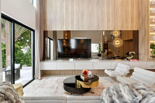 a dining room with furniture and window