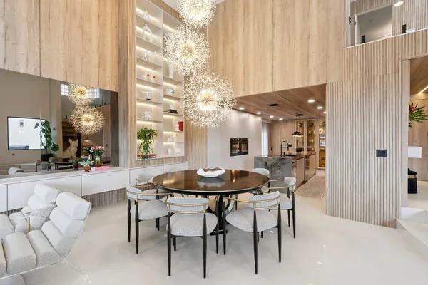 a dining room with furniture and window