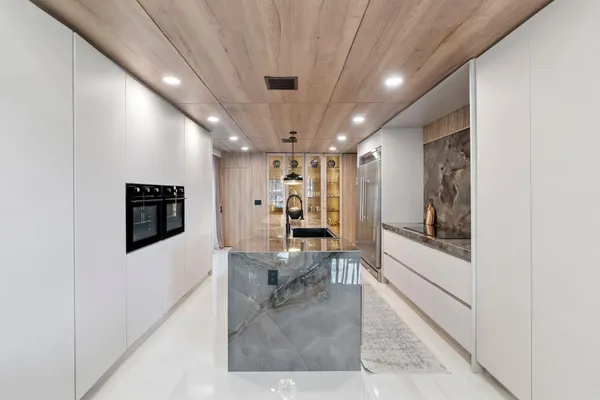 a room with two chairs and a window