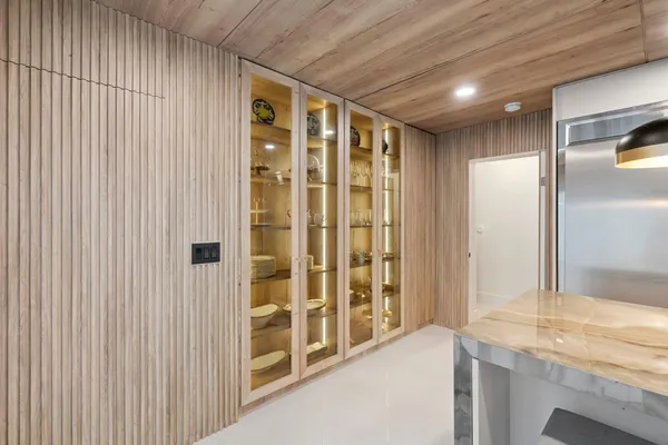 a bathroom with a tub sink and mirror