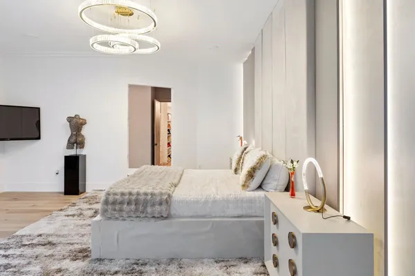 a view of a room that has a window and a table in it