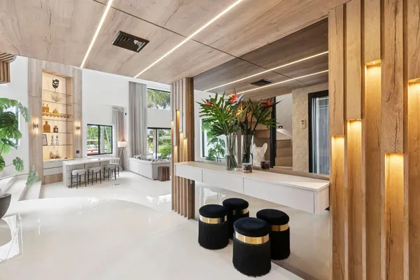 a view of living room filled with furniture and a potted plant