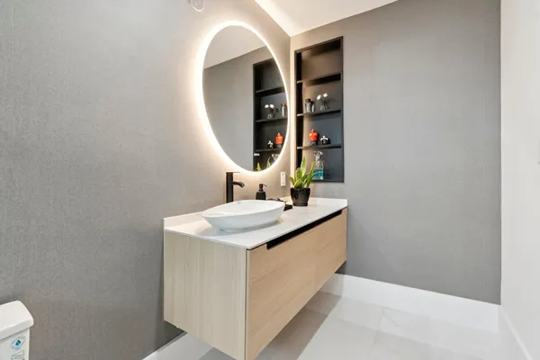 a front view of a house with a yard and palm tree