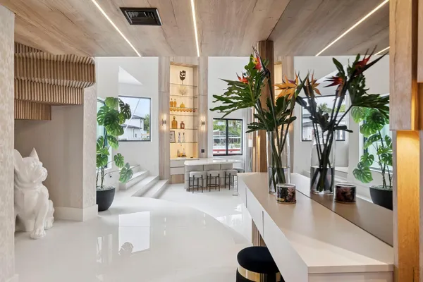 a living room with couches a coffee table and a flat screen tv