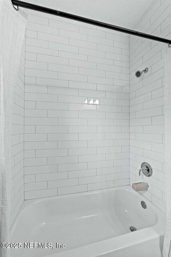 469 Archstone Way St. Augustine, FL 32092 - Photo 30 of 59 a bathroom with a shower and a bathtub