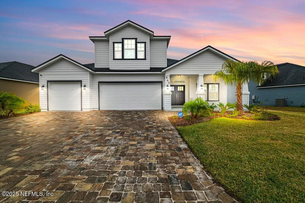 469 Archstone Way St. Augustine, FL 32092 - Photo 3 of 59 a front view of a house with garden