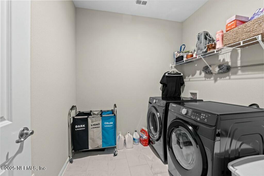469 Archstone Way St. Augustine, FL 32092 - Photo 47 of 59 a utility room with dryer and washer