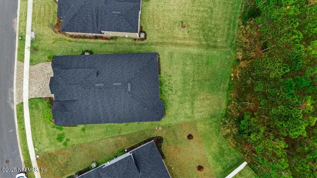 469 Archstone Way St. Augustine, FL 32092 - Photo 5 of 59 a view of a yard