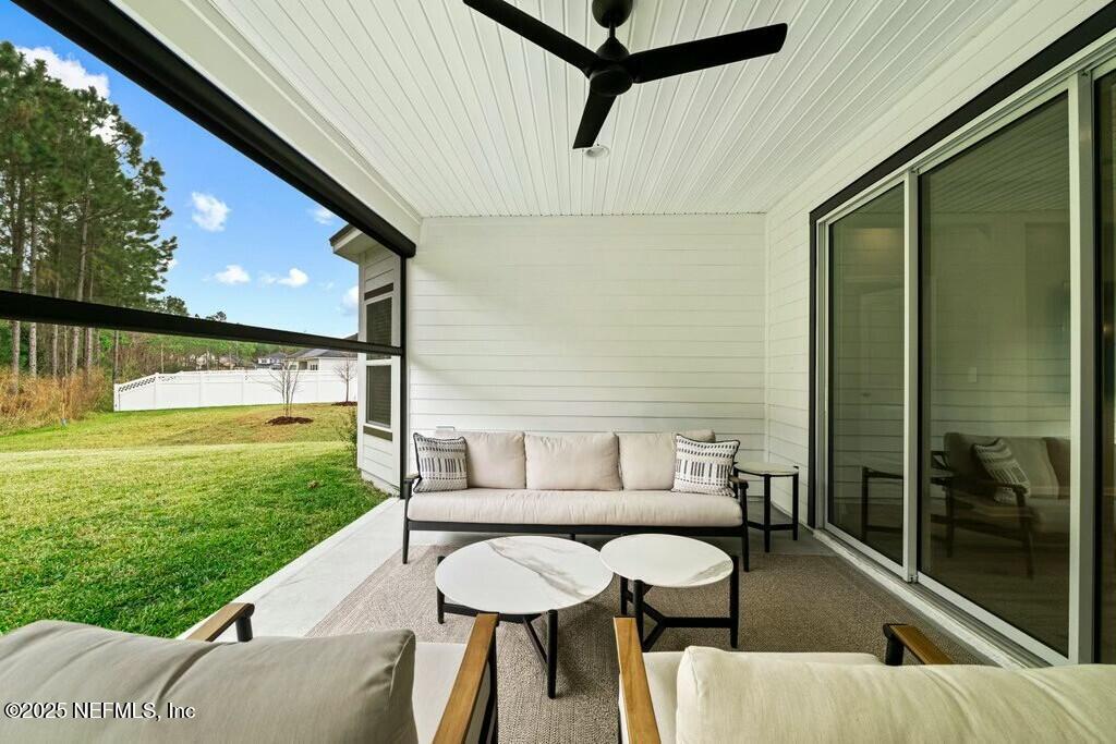 469 Archstone Way St. Augustine, FL 32092 - Photo 51 of 59 a view of a patio with a table and chairs
