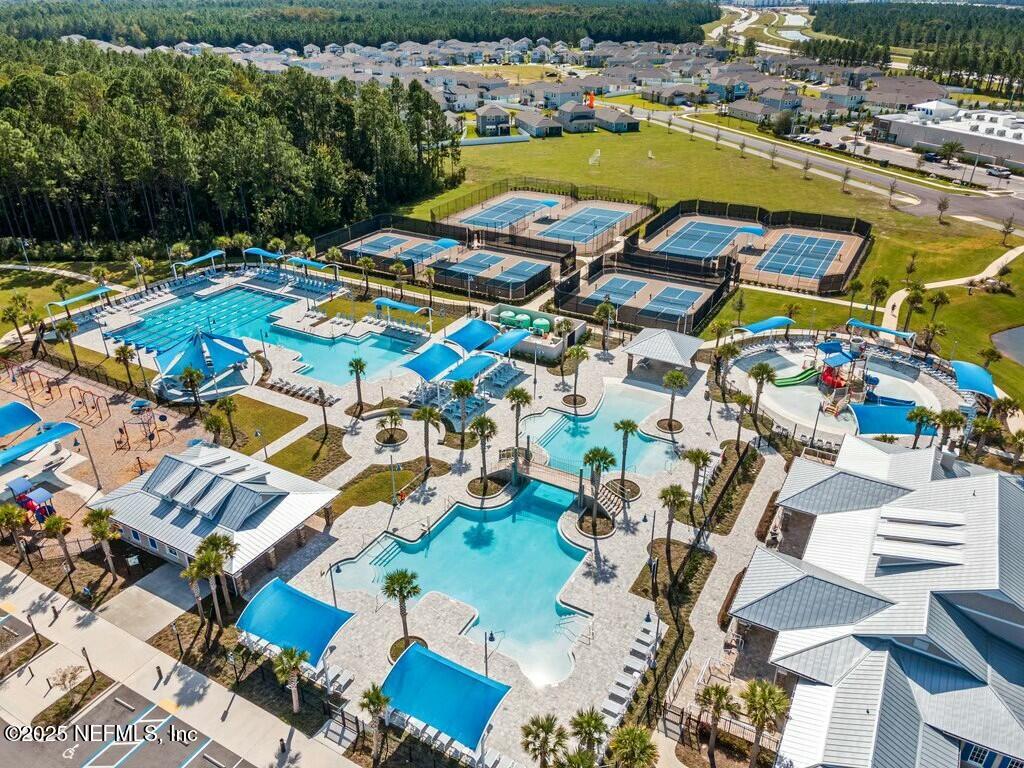 469 Archstone Way St. Augustine, FL 32092 - Photo 58 of 59 an aerial view of residential houses with outdoor space and swimming pool