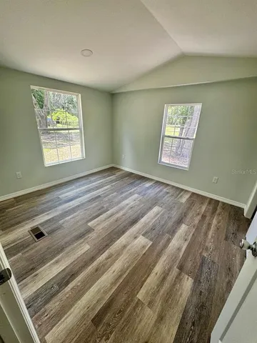 a view of an empty room and window