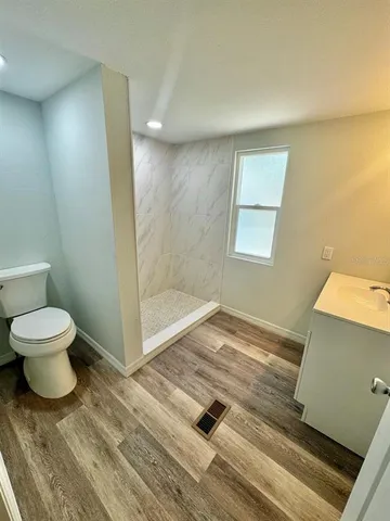 a bathroom with a bathtub and shower